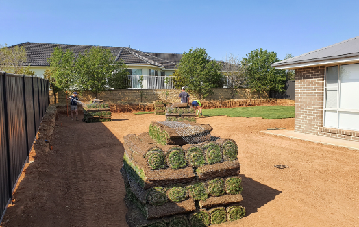 Stack of Fresh Turf on a residential backyard ready to be installed